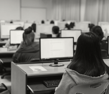 Stock image of students in a computer lab