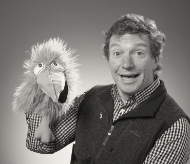 Dr. Tim Bell Headshot - Posing with a puppet