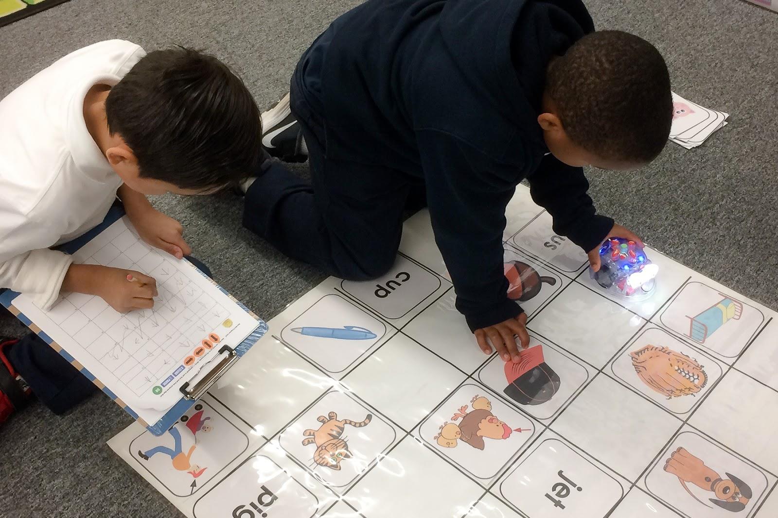 Young students doing computational thinking exercises on the floor