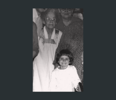 Rebecca Luebker as a young child, posing with her great grandmother
