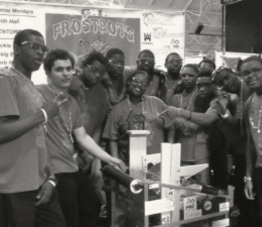 Gray Ward's students posing with their robotics creation