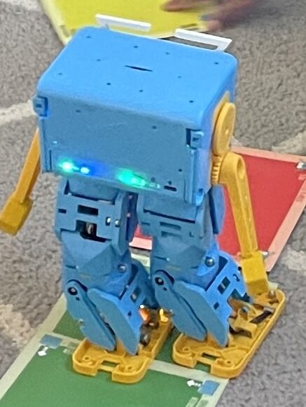 Marty the robot walking on a path made of green and red cards