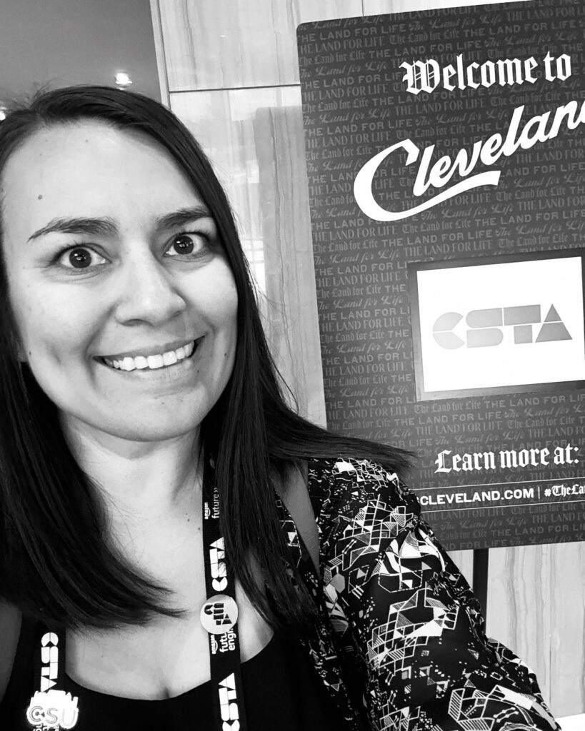 A selfie of Jessa Miles in front of a board that welcomes CSTA members to Cleveland