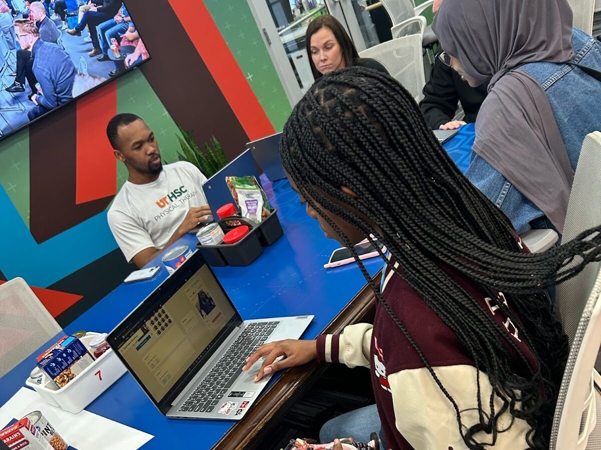 Students discussing the topic around a conference table